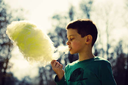 Spring activities by a young boy in a parkの写真素材