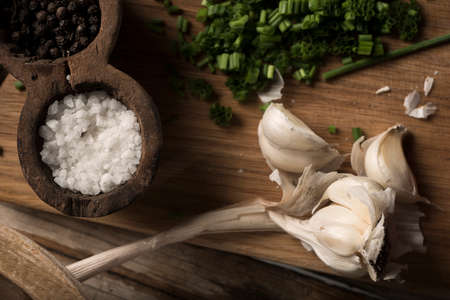 Salad preparation on a traditional wooden tableの写真素材