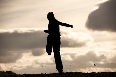 Young boy practicing his football skillsの写真素材