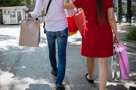 Shopping in the city. Lovely couple having fun on the Macedonian streets.の写真素材