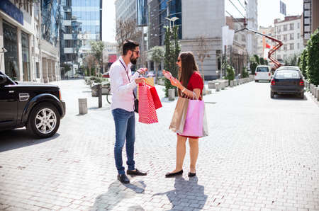 Shopping in the city. Lovely couple having fun on the Macedonian streets.の写真素材