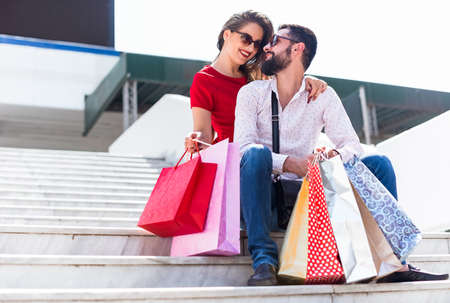 Shopping in the city. Lovely couple having fun on the Macedonian streets.の写真素材