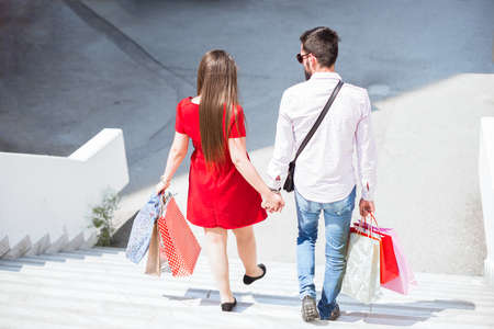 Shopping in the city.Lovely couple having fun on the Macedonian streets,on a sunshine day.の写真素材
