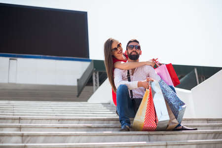Shopping in the city.Lovely couple having fun on the Macedonian streets,on a sunshine day.の写真素材
