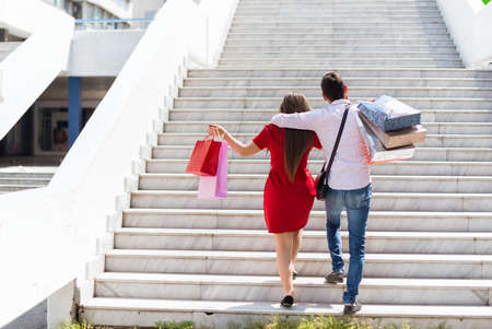 Shopping in the down town.Lovely couple having fun on the Macedonian streets,on a sunshine day.の写真素材