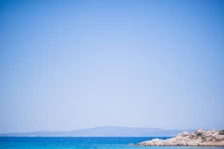 Beach and Sea on a beautiful summer day with clear sky and people swimmingの写真素材