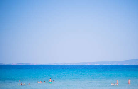 Beach and Sea on a beautiful summer day with clear sky and people swimmingの写真素材