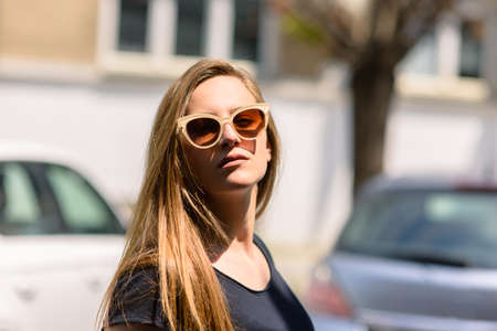 Portrait close up of young beautiful haired woman on summer sceneの写真素材