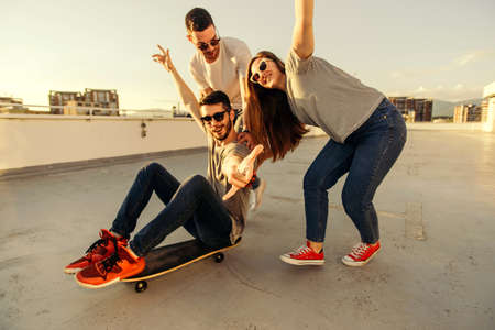 Young skateboard riding skateboar on terrace of the building