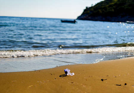 Landscape on beach and diving glasses on sand