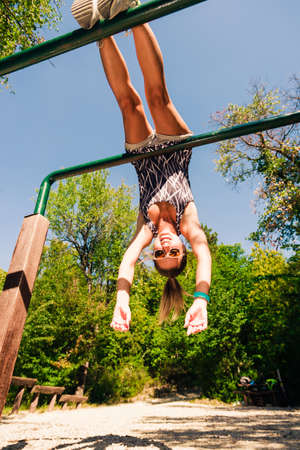Fitness woman in sport wear with perfect fitness body on street workoutの写真素材