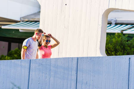 Urban sports healthy couple running through the cityの写真素材