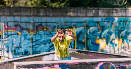 Strong man while training parkour in skateparkの写真素材