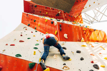 Active lifestyle and bouldering climbing, reaching the top conceptの写真素材