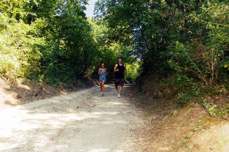 Runners training outise while jogging at urban placeの写真素材