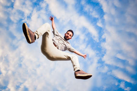 Youung man in air while training parkourの写真素材