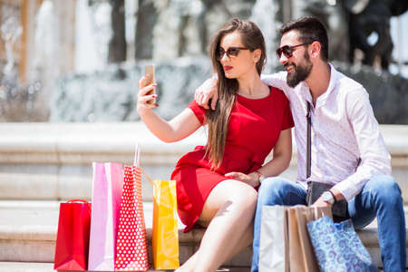 Shopping in the down town.Lovely couple having fun on the Macedonian streets,
on a sunshine day.の写真素材