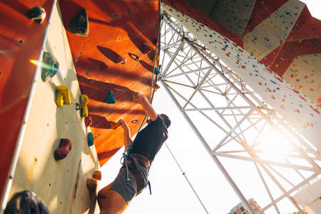 Active lifestyle and bouldering climbing, reaching the top conceptの写真素材
