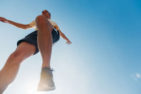 Man trains parkour while jumping in the airの写真素材