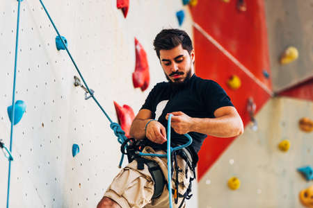 Active lifestyle and bouldering climbing, reaching the top conceptの写真素材