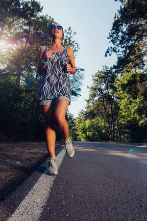Woman fitness jogging workout wellness conceptの写真素材