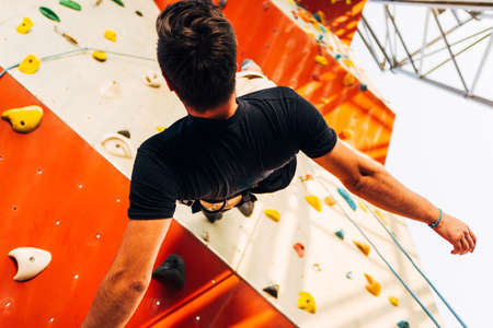 Active lifestyle and bouldering climbing, reaching the top concept