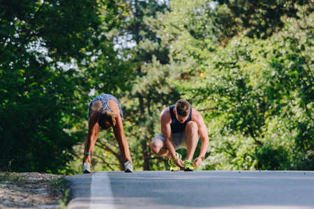 Runners training outise while jogging at urban placeの写真素材