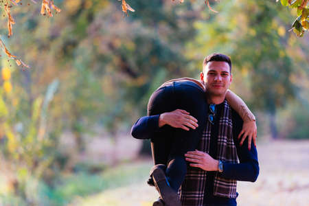 young and foolish boyfriend carries his girlfriends on his back.の写真素材