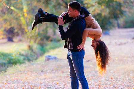 young and foolish boyfriend carries his girlfriends on his back.の写真素材