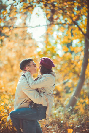 Sweet couple is in the park, spending time together on a beautiful weatherの写真素材