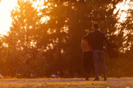 Two lovers sharing a moment before sunset.