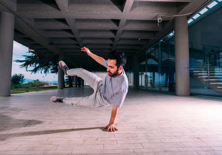 Sportsman training parkour outdoors
