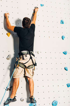 Active lifestyle and bouldering climbing, reaching the top conceptの写真素材