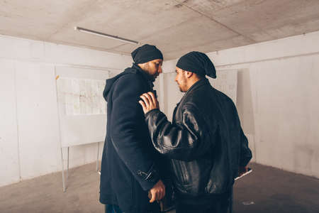 Dangerous men are having a big fight about the stolen moneyの写真素材