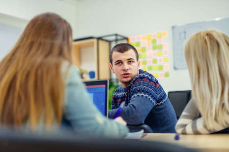 Urban students are listening to a lecture and discussing on class