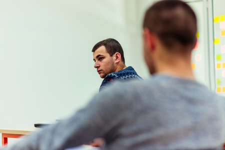 Students are on class looking serious while listening a lecture