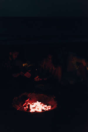 Summer roasting of sausages on fire. Holiday in the beach. Preparation of food on fireの写真素材