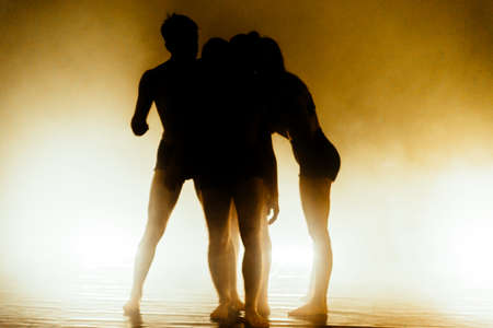 Handsome young dancers performing a contemporary ballet routineの写真素材
