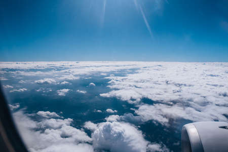 Scenic view above the clouds during a commercial flightの写真素材