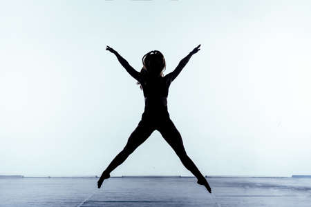 Young ballet performer during a dance practice at the studioの写真素材