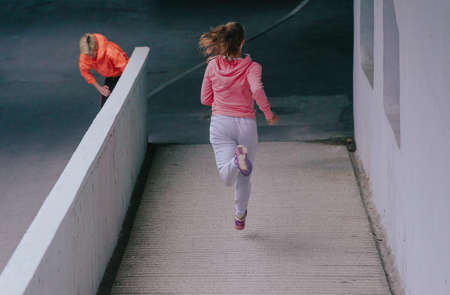 Attractive female athlete going for a run in an urban environment