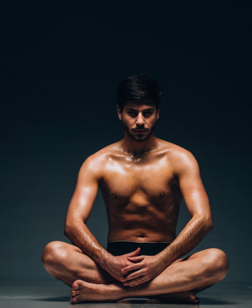 Man body in black man underpant over dark background in photo studio. Bright man underwear conceptの写真素材