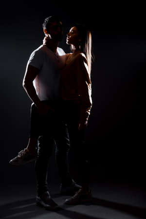 Portrait of a good looking young couple dressed in stylish clothingの写真素材