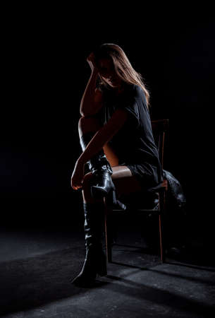 Studio body shot of a fashion female model posing in modern clothingの写真素材