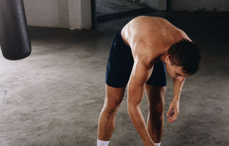 Handsome professional boxer dress up t-shirt after training boxの写真素材