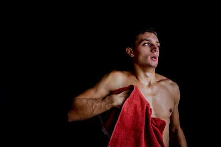 Handsome young boxer prepare for training in undeground garageの写真素材
