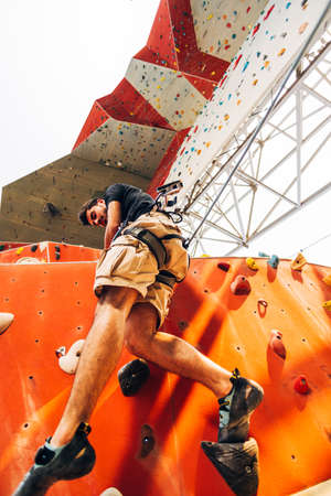 Active lifestyle and bouldering climbing, reaching the top conceptの写真素材