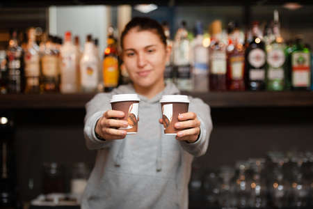 Successful young business people sharing ideas and smiling while working together on a project in a ...