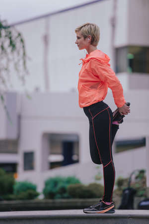 Healthy lifestyle athlete dressed in training clothes exercisingの写真素材