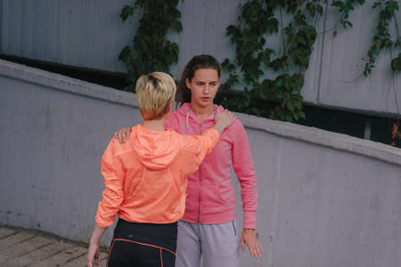 Fit female runners performing their sport activity outdoorsの写真素材